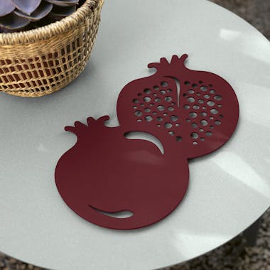 Fermob Pomegranate trivet on side table