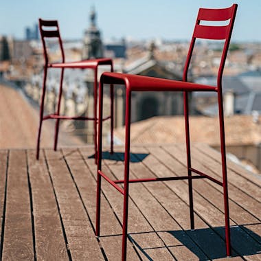 Fermob Facto bar chair in red on roof terrace in Paris