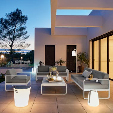 Fermob Outdoor Sofas in Cotton White with Outdoor Lighting at Night