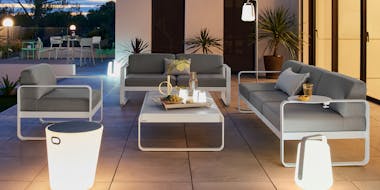 Fermob Outdoor Sofas in Cotton White with Outdoor Lighting at Night
