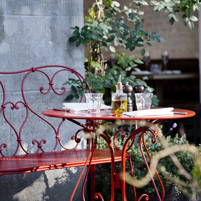 Fermob 1900 Outdoor Table & Bench in Poppy at Restaurant Chan in Berlin