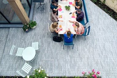 Fermob Bistro setting with Ribambelle extending table and Luxembourg chairs in office courtyard