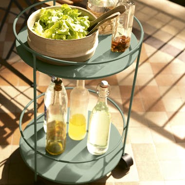 Fermob Guinguette side table with wheels loaded up with salads and drinks