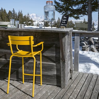 Fermob Luxembourg high armchair on deck at ski resort